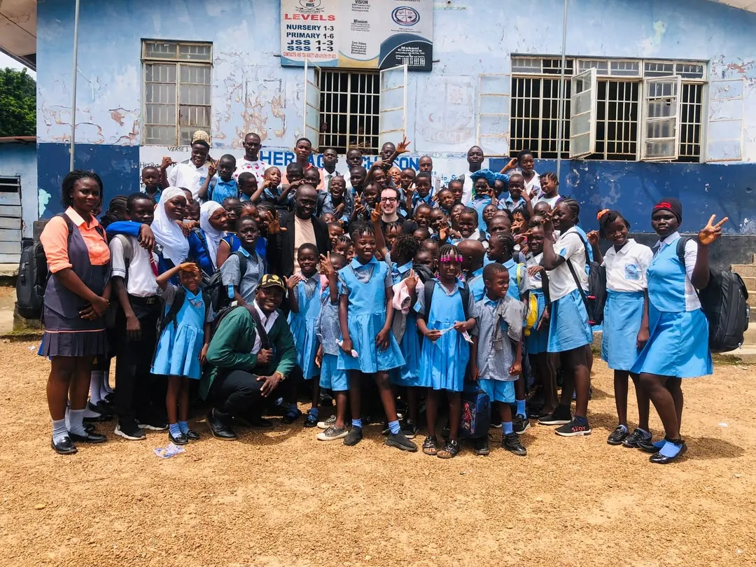 Max with students and teachers at Heritage Pre-High School, Makeni, Sierra Leone